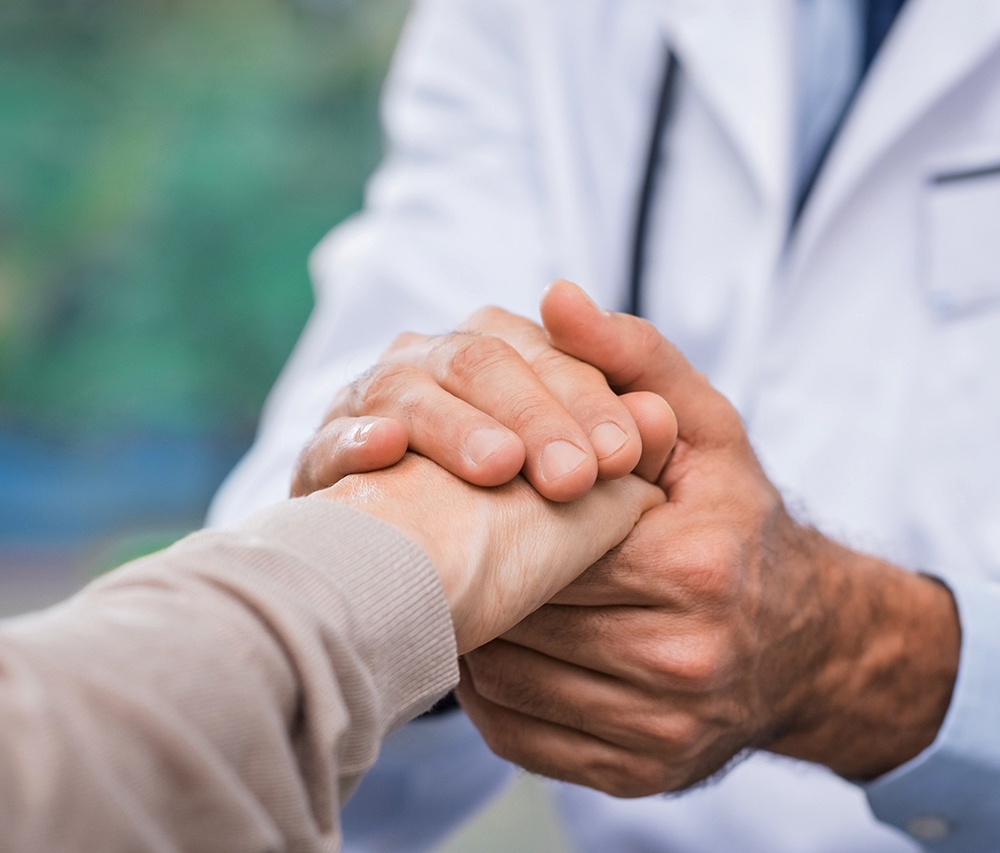 man holding woman's hand